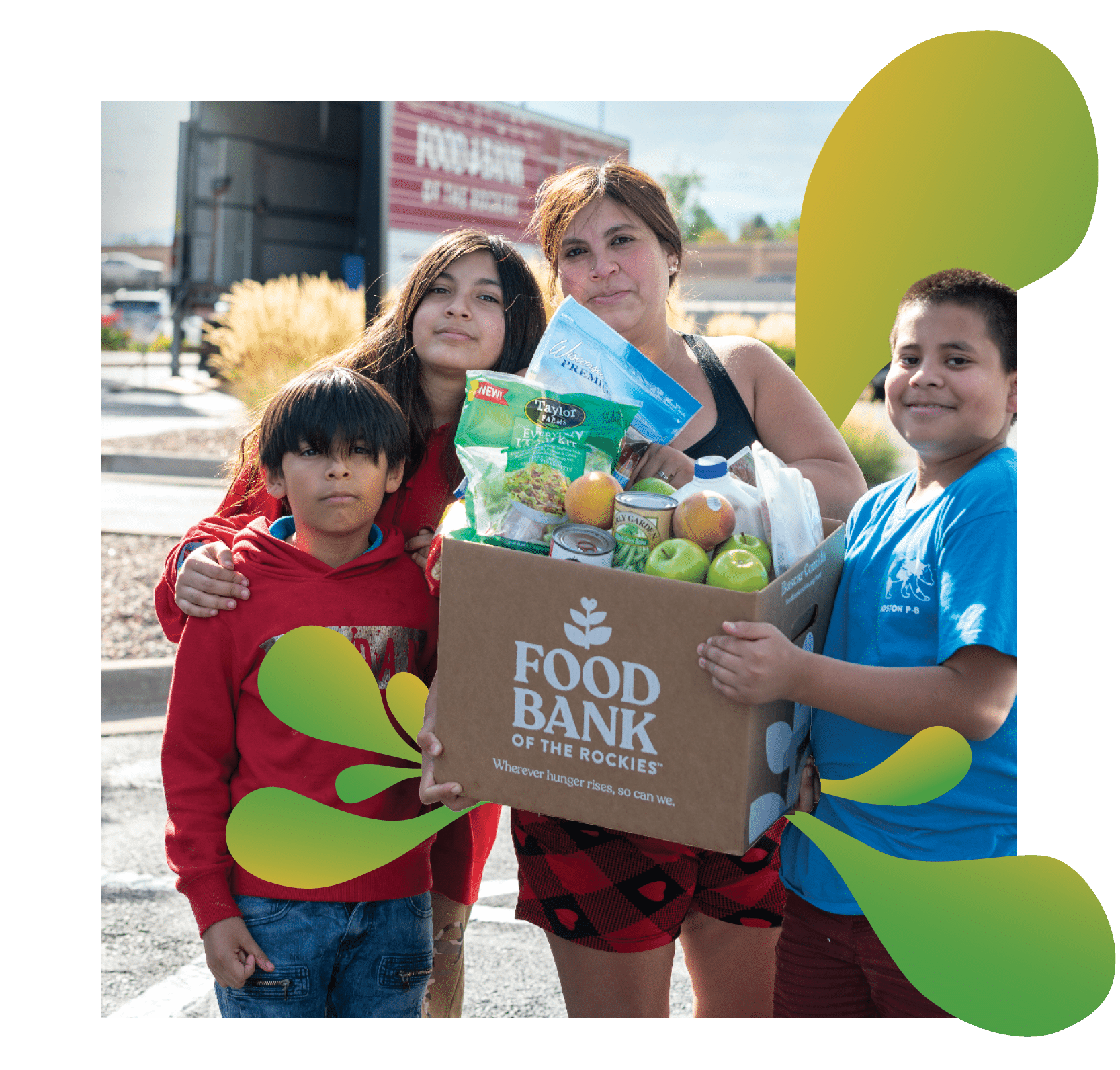 a family holding a box of food