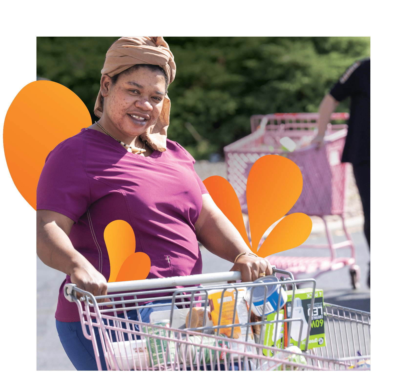 a person pushing a shopping cart full of food