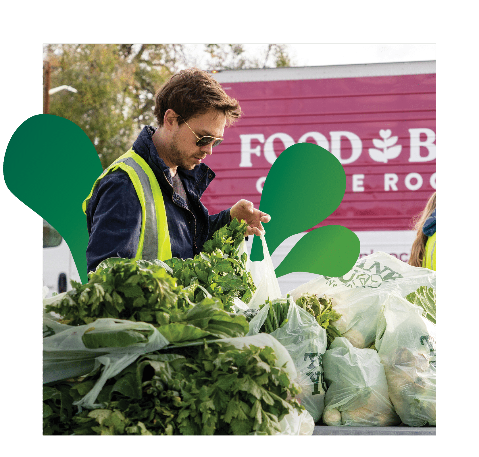 a food bank volunteer filling bags with fresh greens