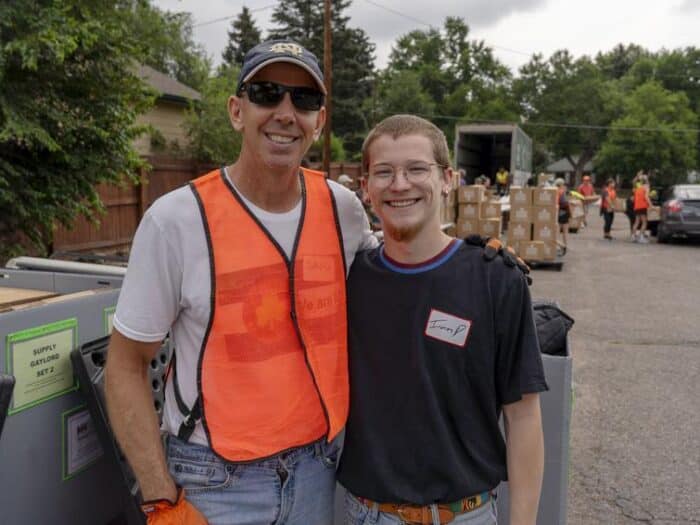 Father and son volunteers at a mobile pantry.
