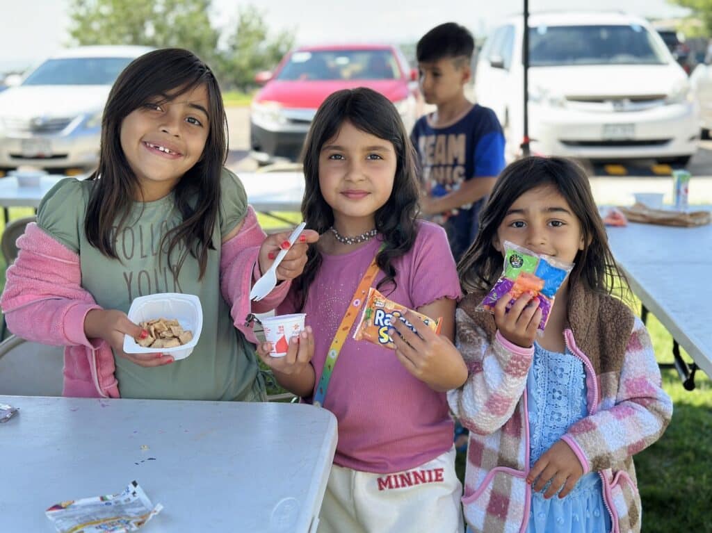 children enjoying their lunch outside