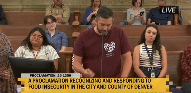 a person speaking at a podium 