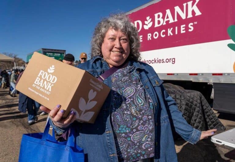person holding a box of food