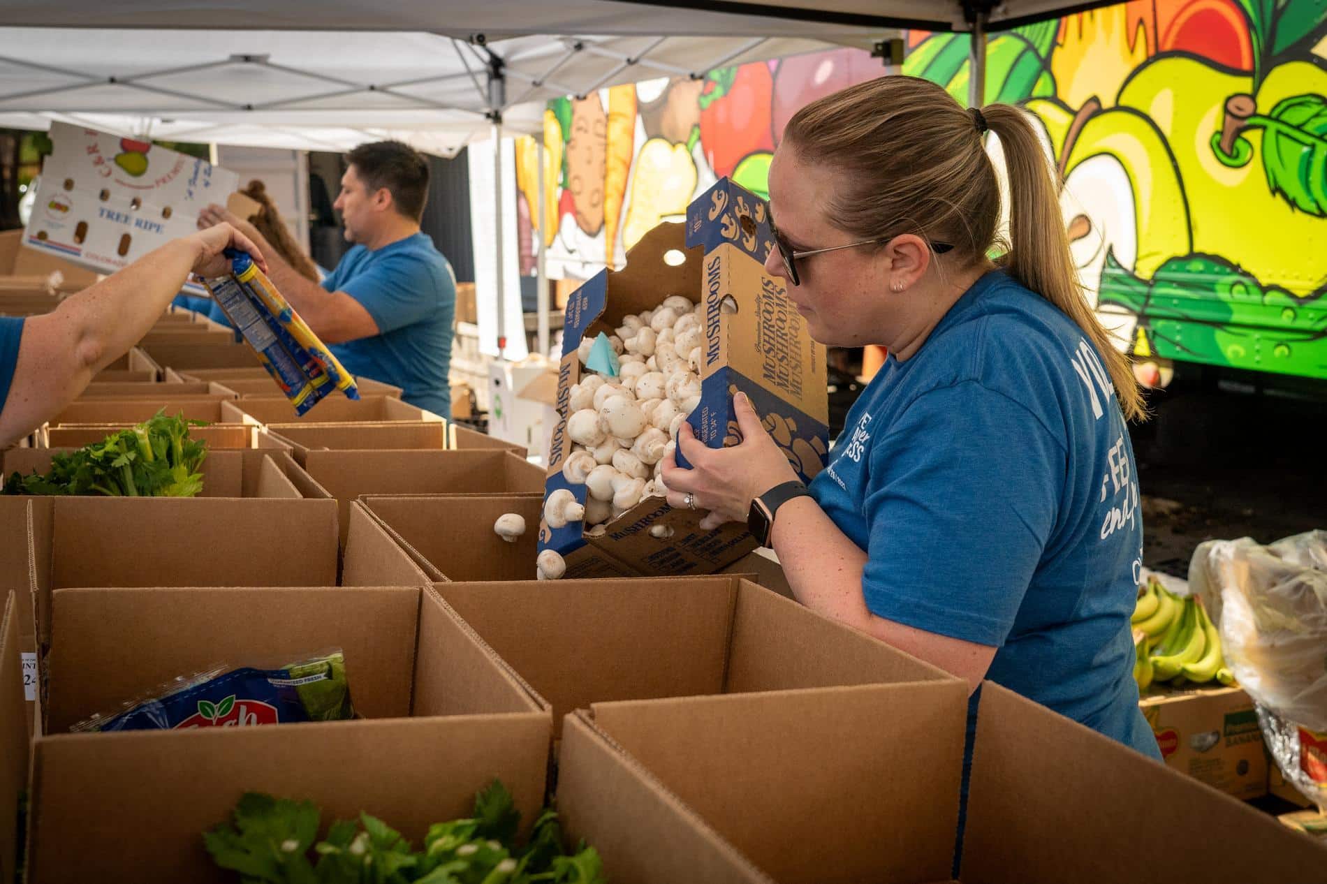 fresh foods in boxes at a food pantry