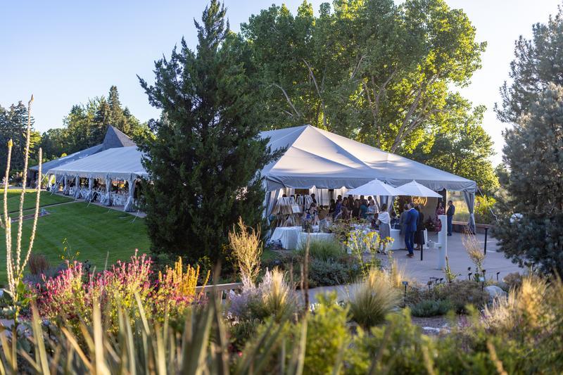 Denver Botanic Gardens with event tent for Gather & Sow. Lush greens and plants surrounding the tent.
