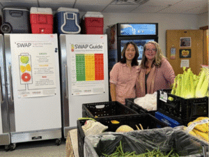 Jennie Kim, MPH, RDN (Nutrition Manager) with Shellie McKeown, Community Health Manager, at Mountain Resource Center’s food pantry