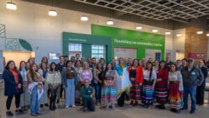 Large group of staff posing in the lobby of the new distribution center.