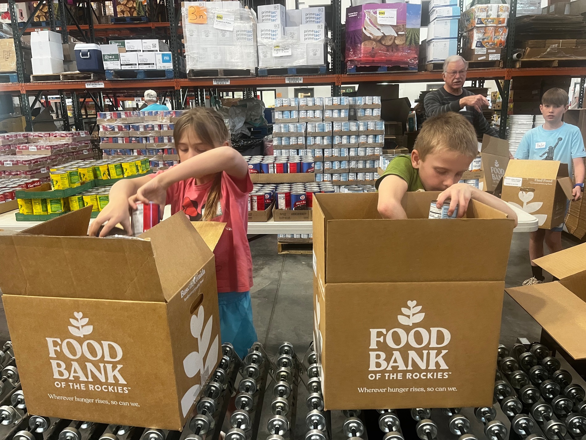 kids packing food bank boxes.