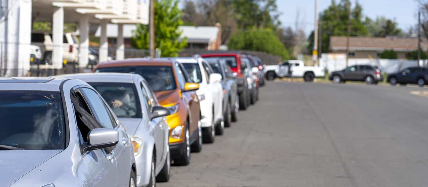 a line of cars at the mobile pantry at Hinkley high school