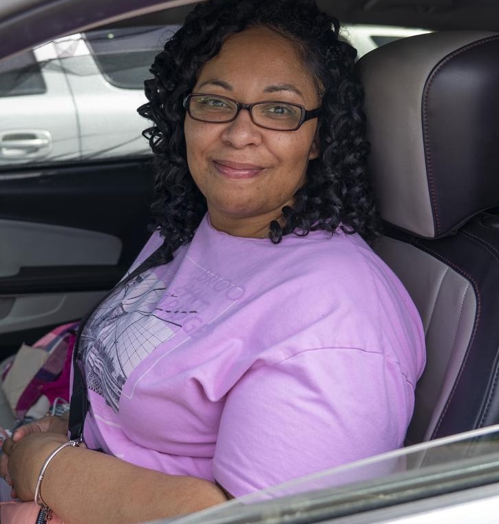 A woman in her car at a mobile food pantry in Colorado.