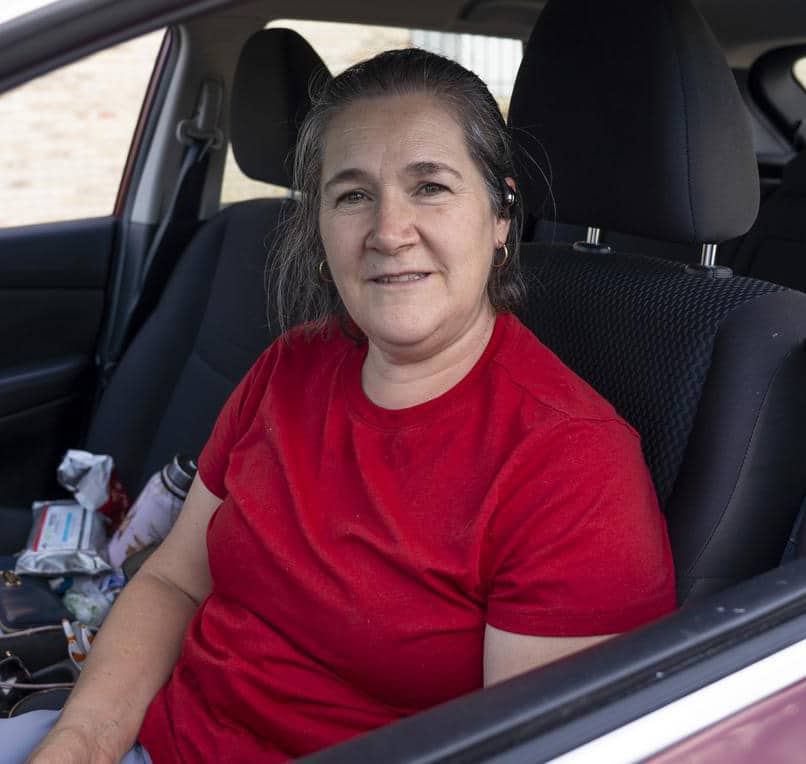 A woman in her car at a mobile food pantry in Colorado.