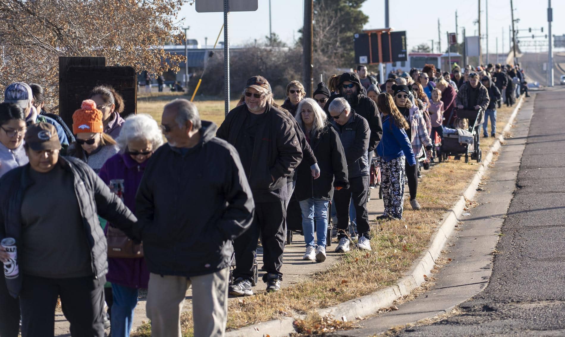 Neighbors lined up at a Thanksgiving food distribution in November 2025.